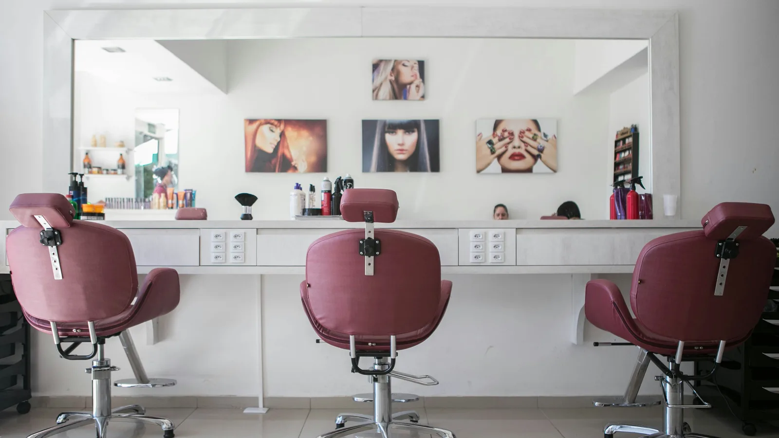Hair salon interior with styling chairs and mirrors