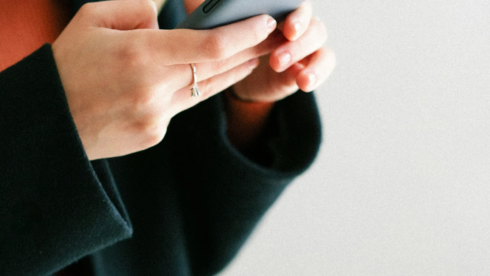 Hands using a smartphone