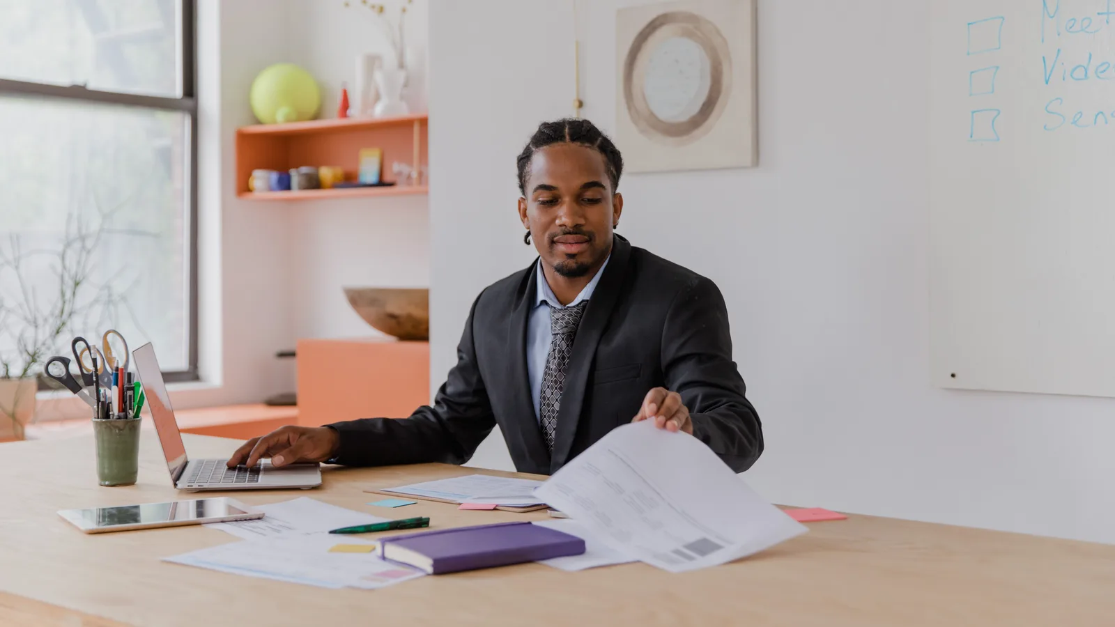 Man reviewing documents at a desk