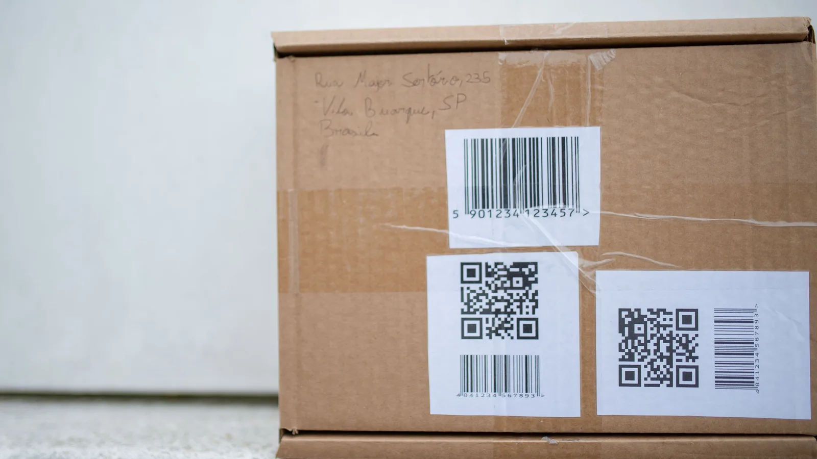 Shipping box with barcodes and tracking labels