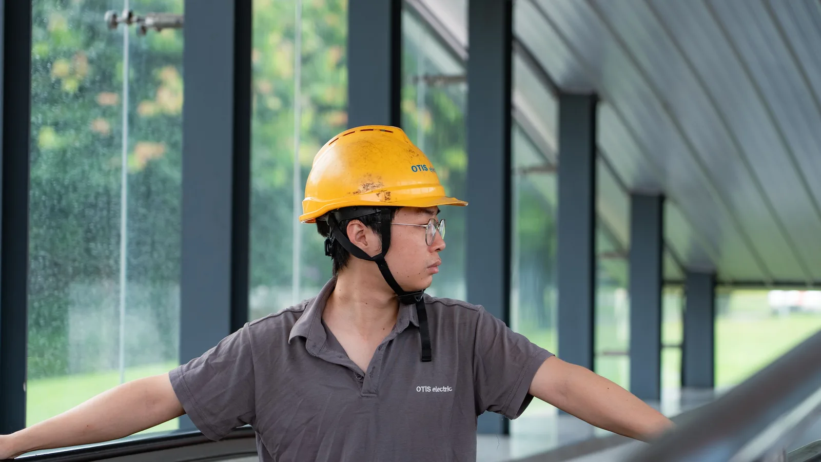 Person wearing a safety helmet at a construction site
