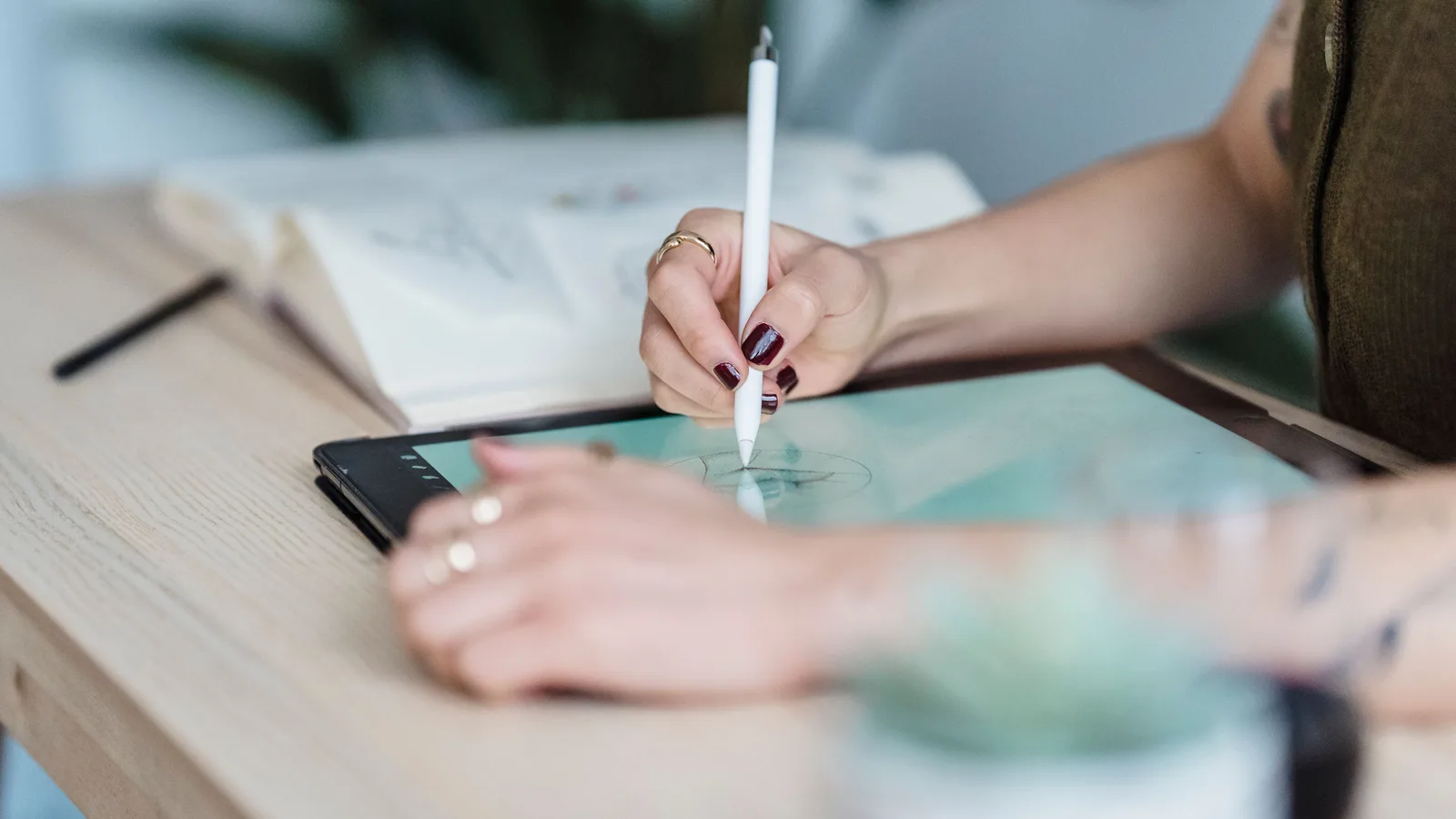 Designer drawing on a tablet with a stylus