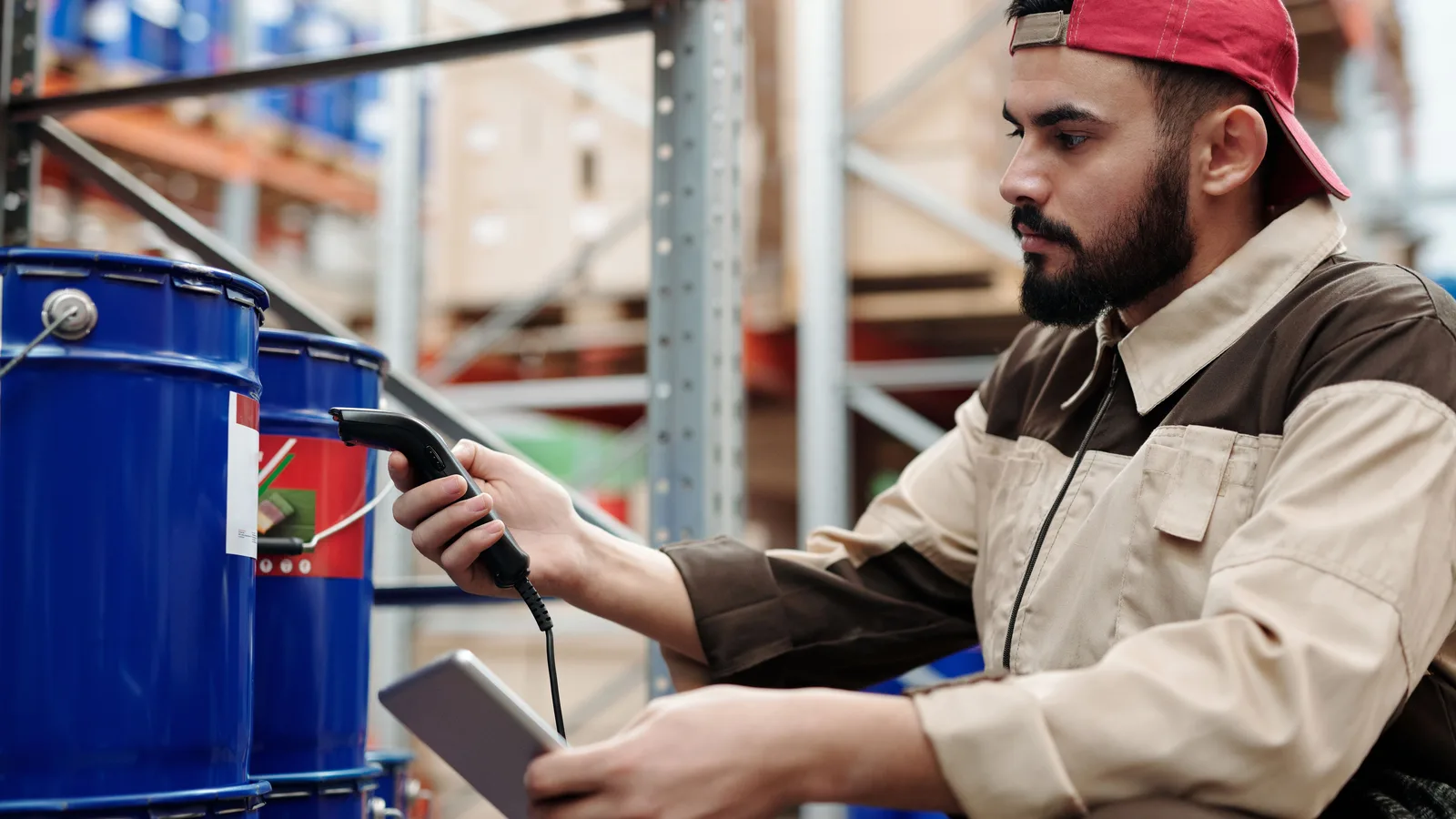Warehouse worker scanning a container with a tablet