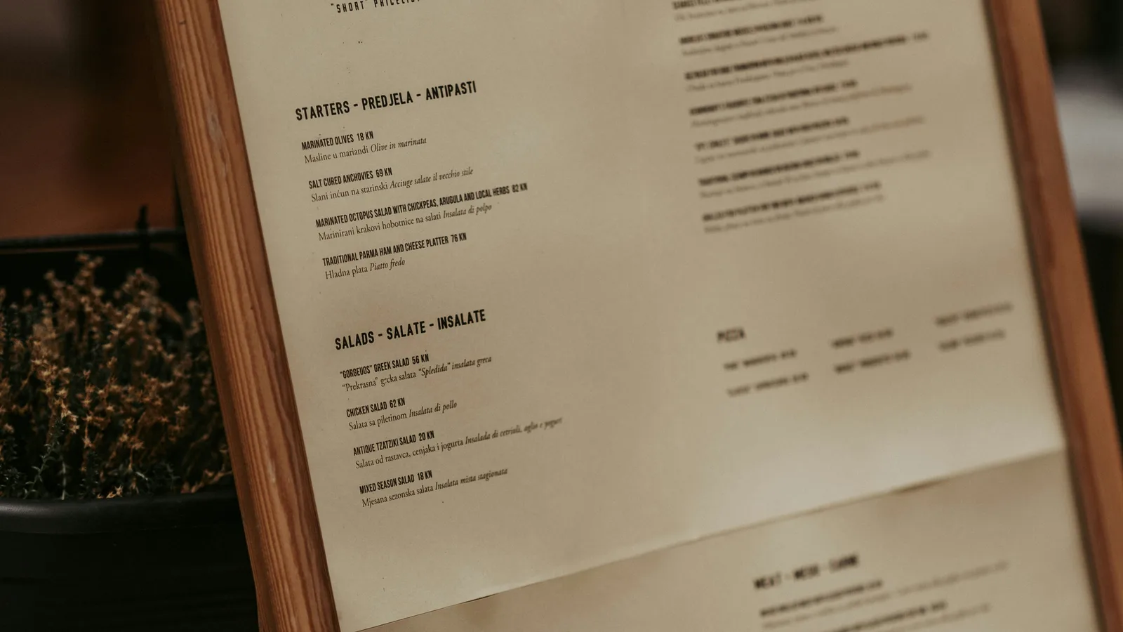 Printed restaurant menu displayed outside a venue