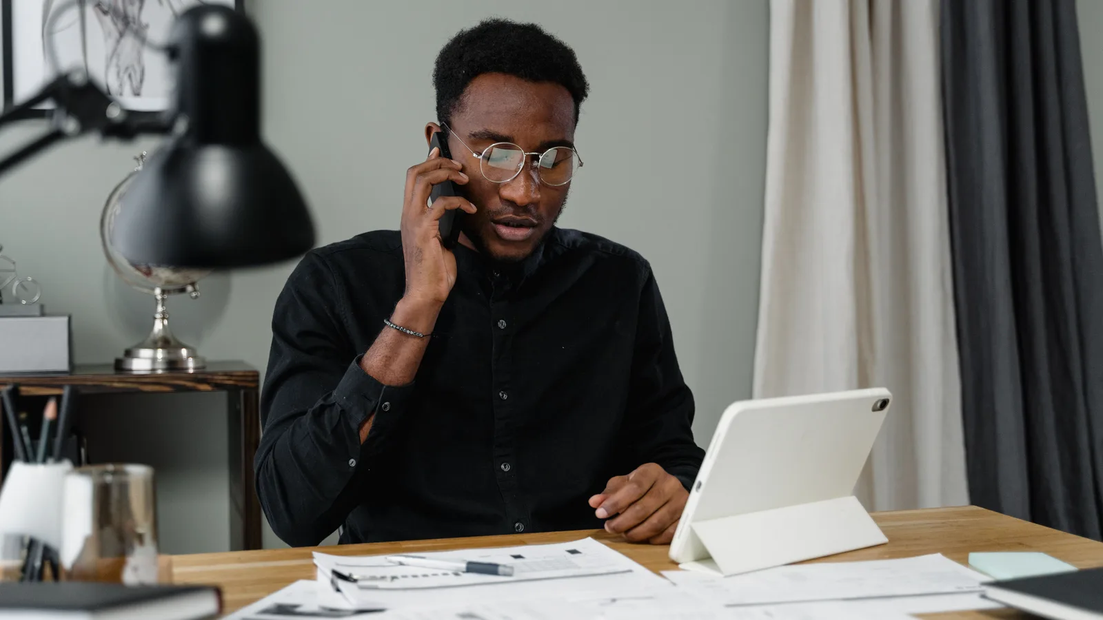 Man taking a business call at a desk