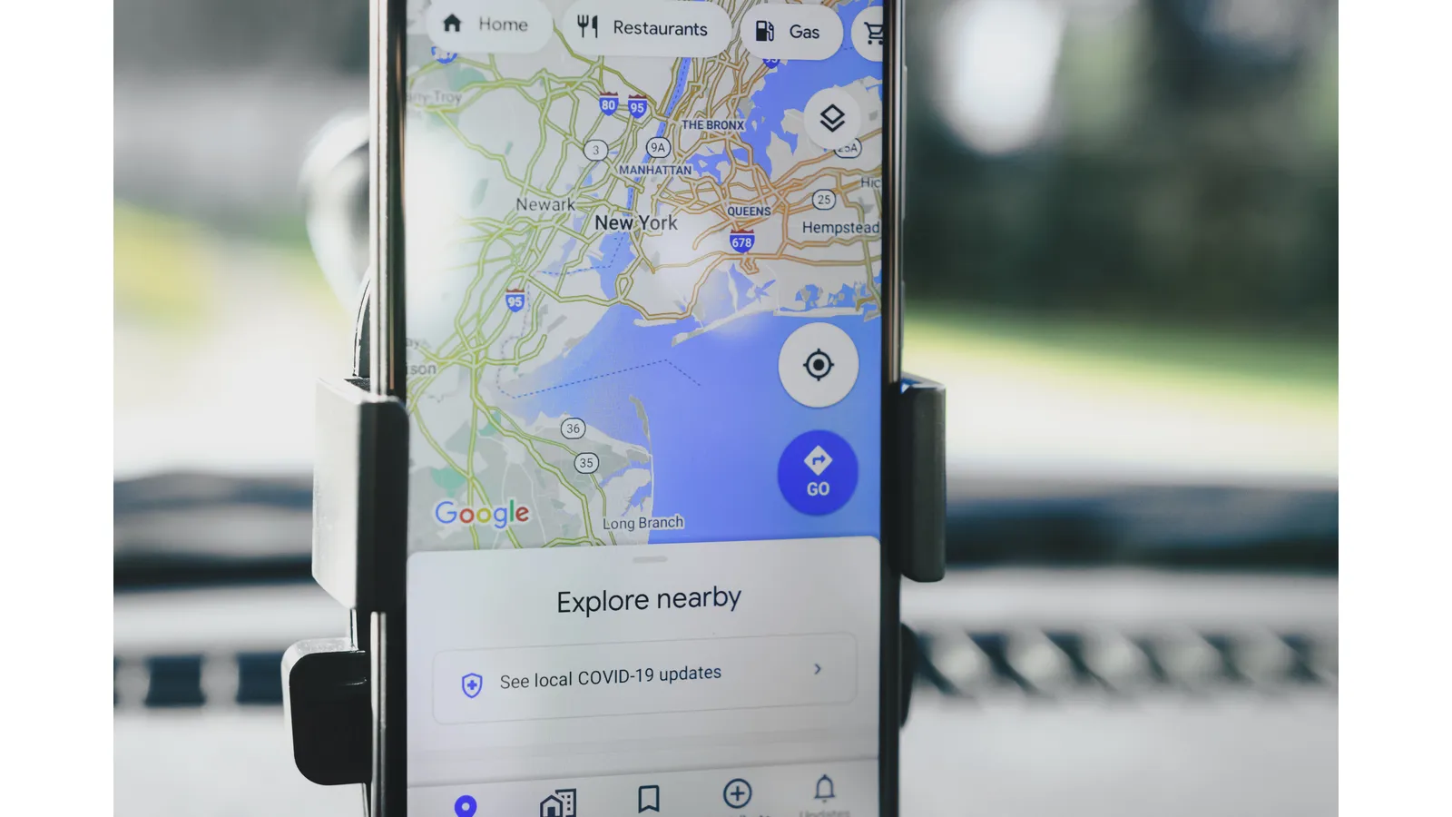 Smartphone displaying a street map in a car mount