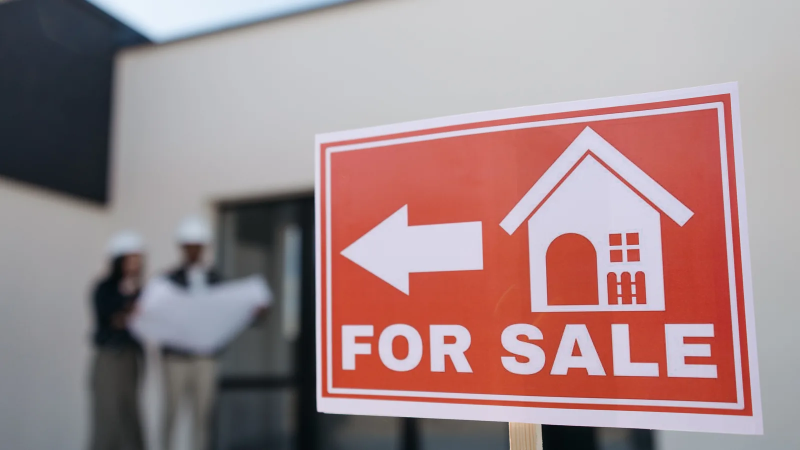Property sale sign outside a building