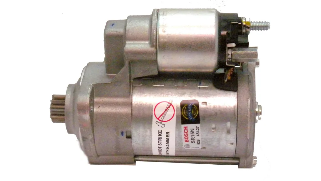 Starter motor photographed against white