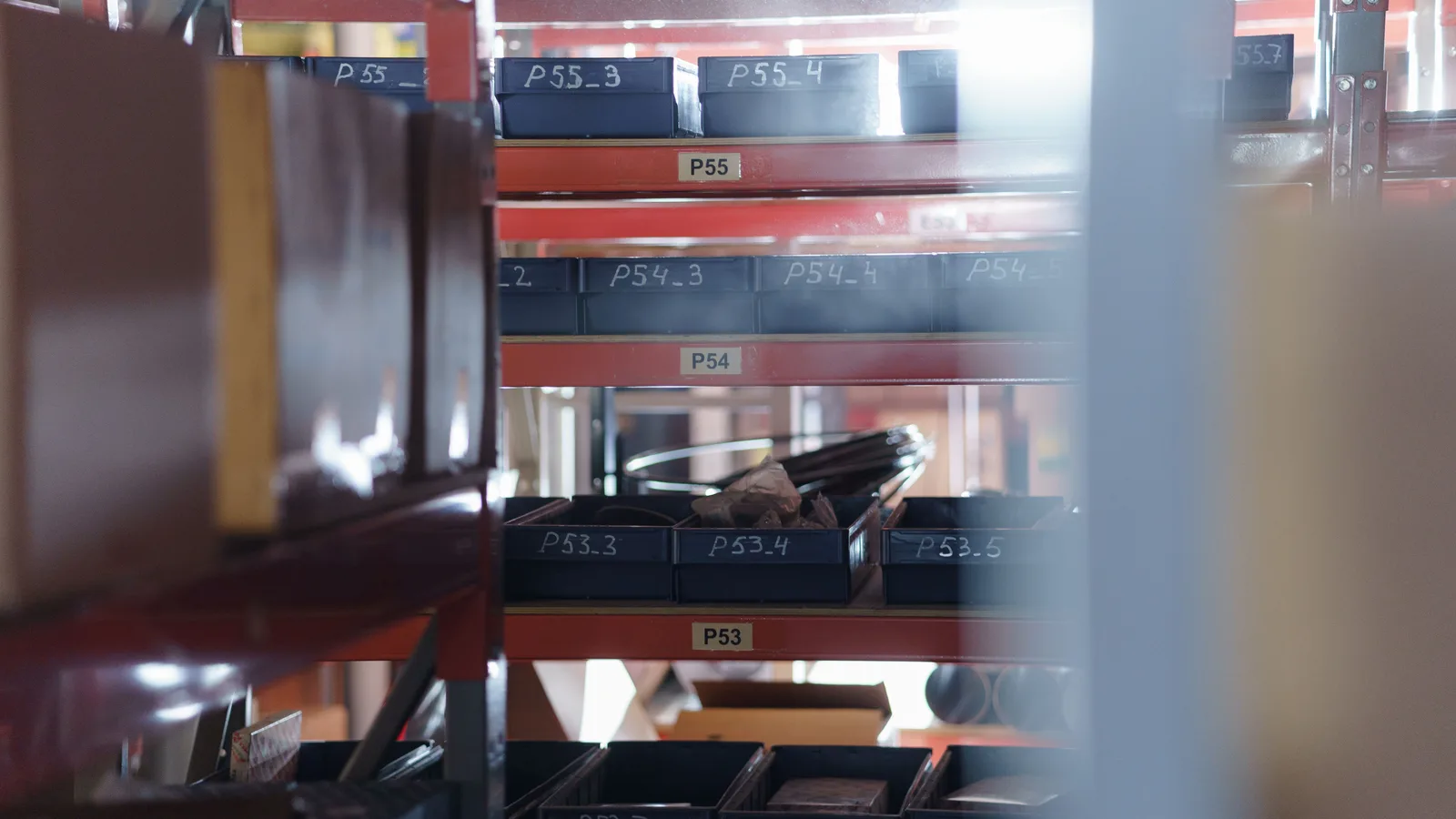Indexed archive boxes on shelving