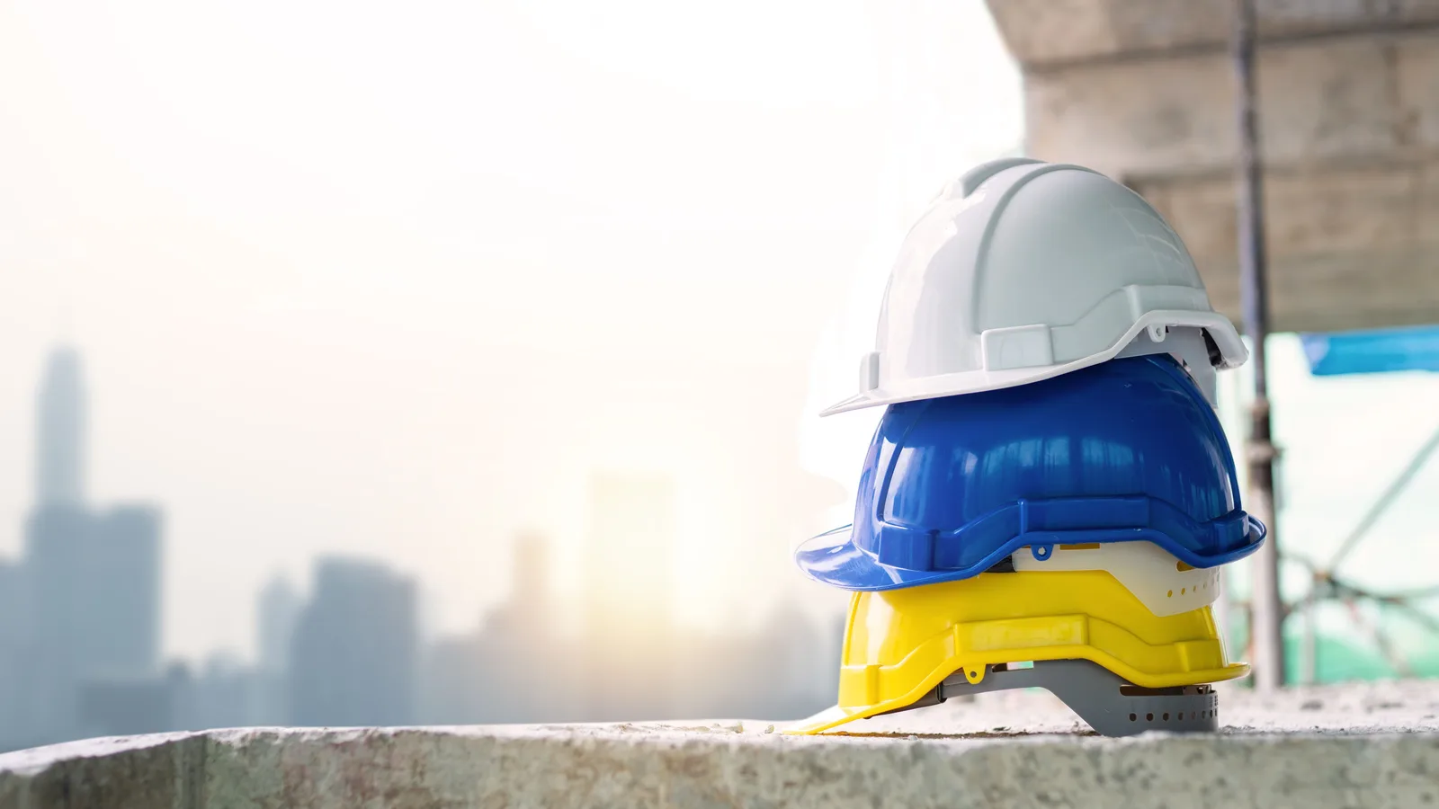 Stacked safety helmets at a construction site