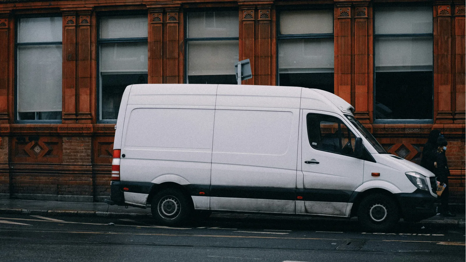 Unbranded white delivery van parked on a street