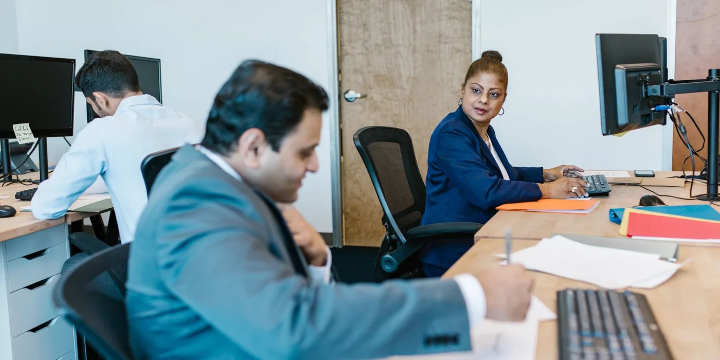 Employees working together in an office