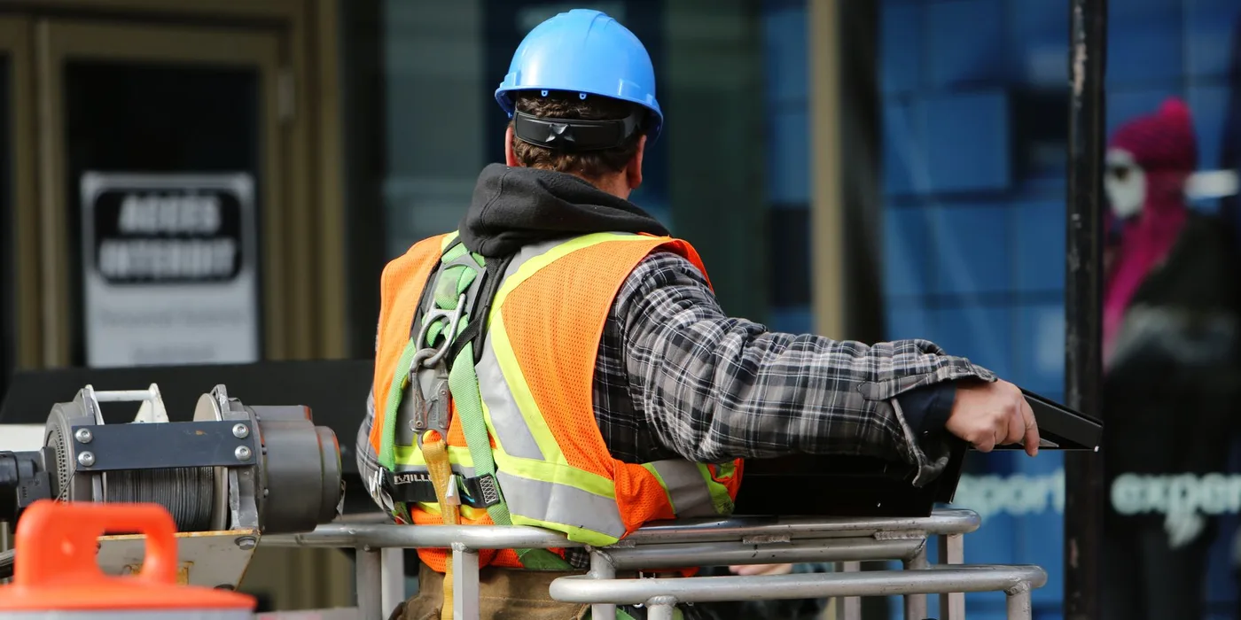 A construction worker in safety gear on site