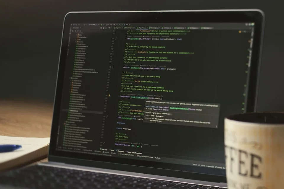 A focused work session at a laptop with coffee