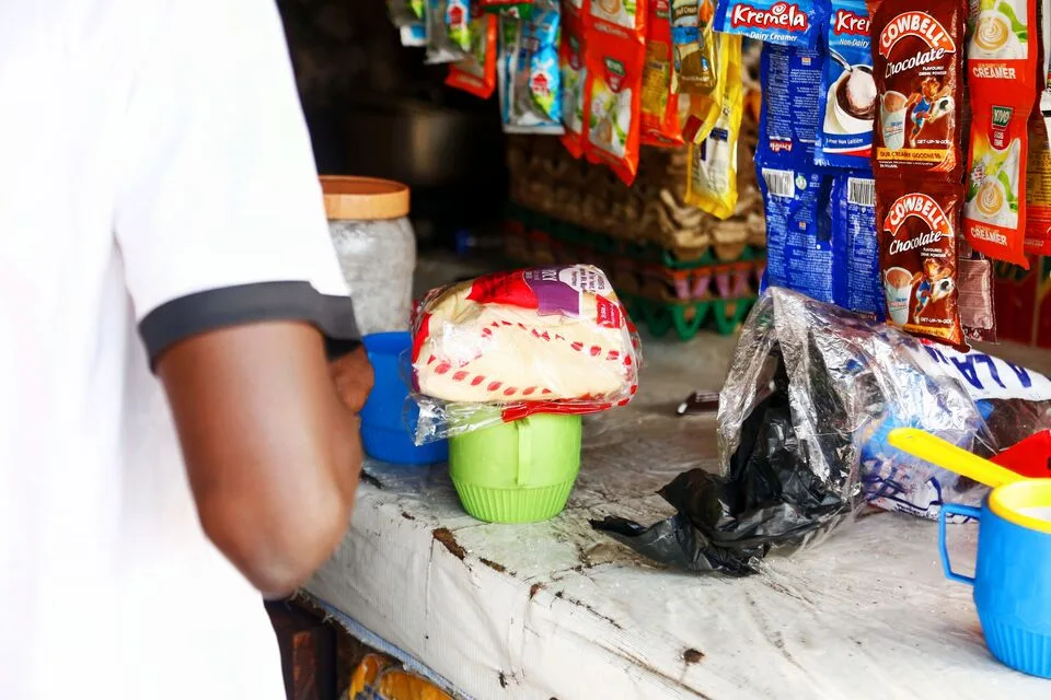 A local market stall with packaged goods on the counter